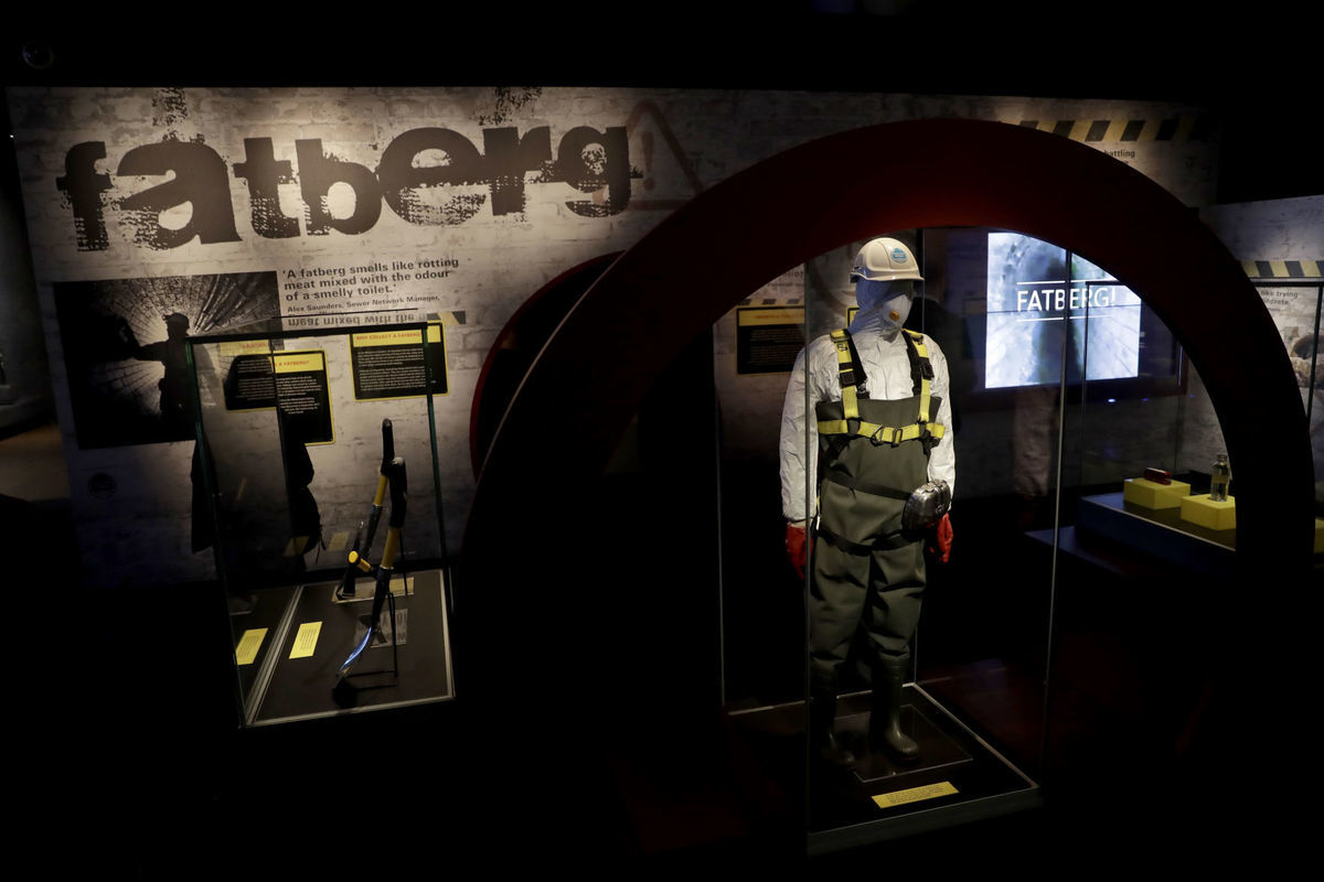 The exhibit showcases the kind of protective gear sewer workers had to wear while working to clear the fatberg. (Photo by Associated Press)