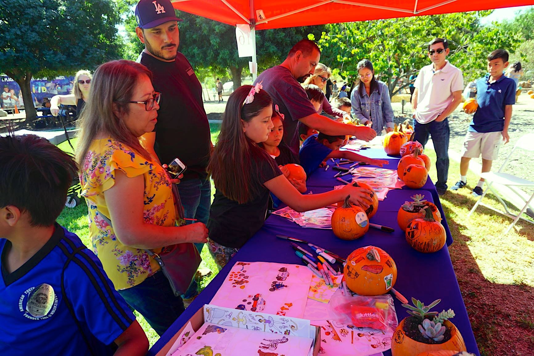 Pumpkin decorating is a popular family attraction at the water conservation festival.
