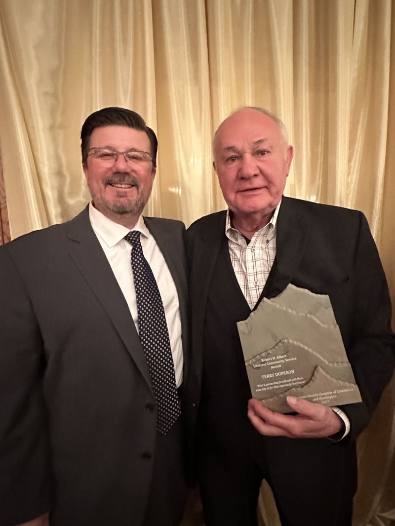 Mark Turpin, left, president of Duperon Corp. with award recipient Terry Duperon.